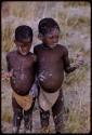 Two boys holding clay horses