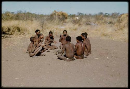 Story Telling, Game: Group of men and boys playing !’Om g!xuni / ’Ai kota !U!u g!xuni / N!aih //’an (the porcupine game or the "axe and assegai game") including "/Qui Navel," !Naishi (son of Khwo//o, brother of "/Gao Music"), ≠Toma (Gau's son), "Gao Medicine," /Gunda and //Ao