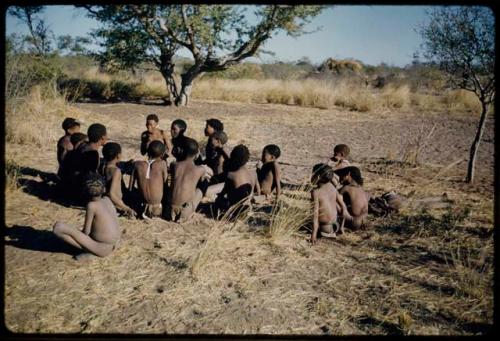 Story Telling, Game: Group of men and boys playing !’Om g!xuni / ’Ai kota !U!u g!xuni / N!aih //’an (the porcupine game or the "axe and assegai game")