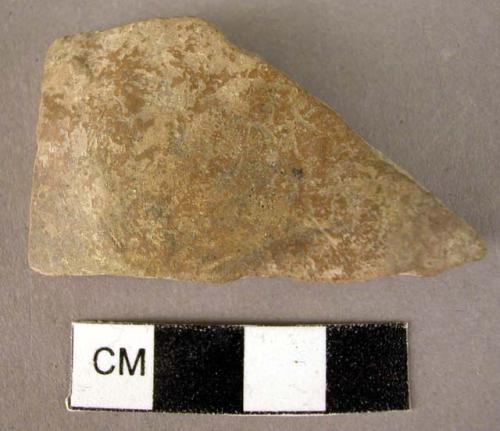 Pottery base fragment - plain, burnished. Brown exterior, red slip interior