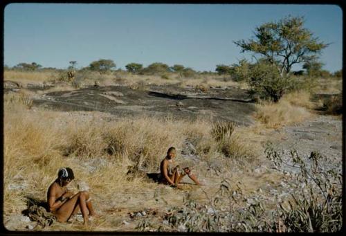 Water: !Ungka and another woman bathing near a waterhole