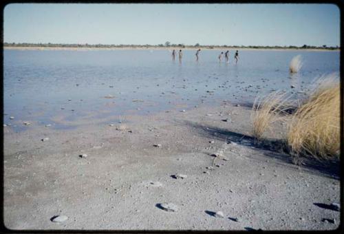 Water Hole: Boys playing in water in Gautscha Pan