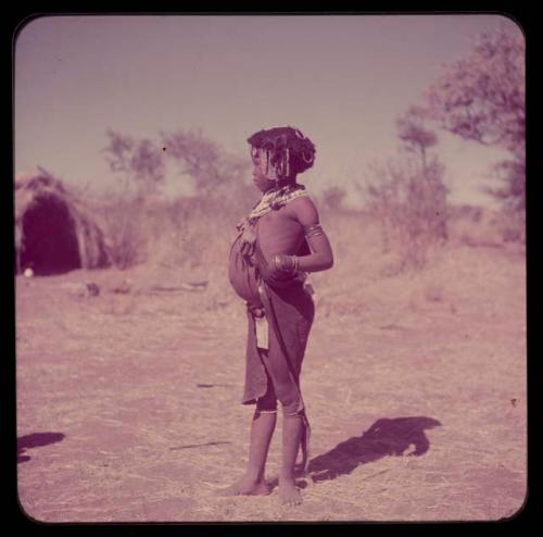 Children, Portraits: ≠Gisa wearing a little kaross and an ostrich eggshell beaded apron, profile