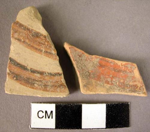 2 potsherds - two painted curves, octopus or spiral