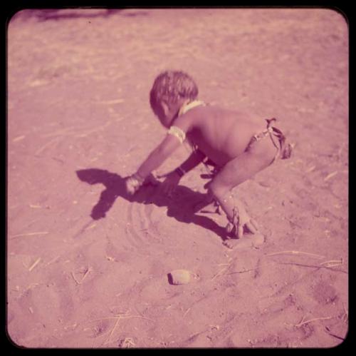 Children, Toys, Playthings: Child pushing a toy car made from veldkos