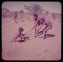 Children, Toys, Playthings: Tsamgao and another boy pulling a child on gemsbok horns