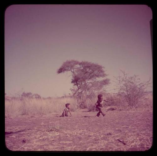 Children, Dance: /Gaishay dancing, with "Little ≠Gao" sitting near him