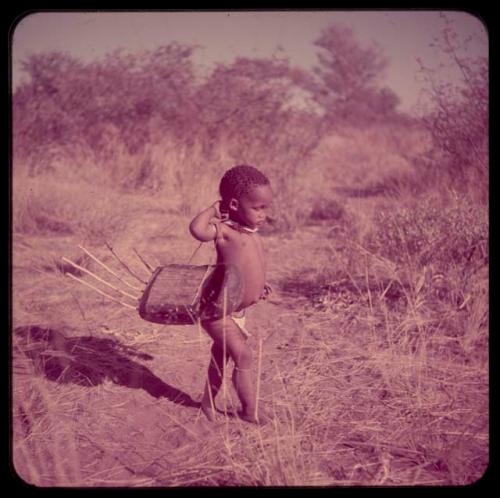 Children, Music: Little girl carrying a //guashi