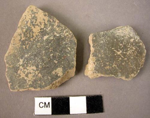 2 potsherds - black "Ufirnis" glaze slip