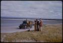 Man with a dog talking with Wilhelm Camm and Laurence Marshall, pan in the background