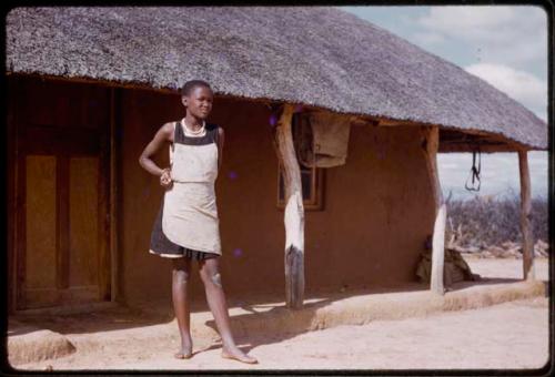 Girl standing in front of a house