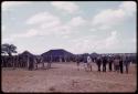 Expedition members leaving the village