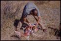 William Donnellan cutting open a skinned springbok