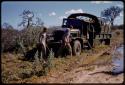 Expedition GMC truck on the side of a road, William Donnellan and Theunis Berger standing in front