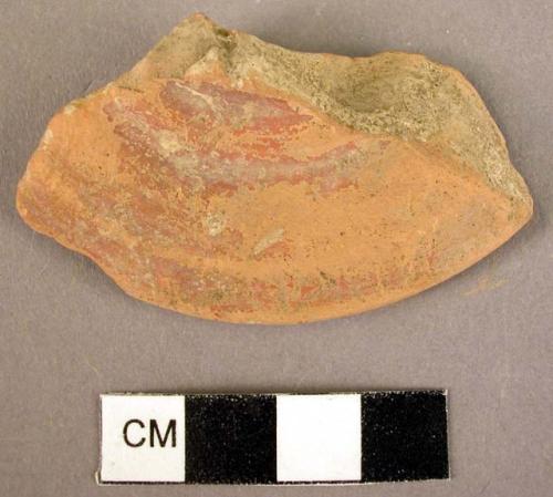 Fragment of red glazed Mycenaean foot