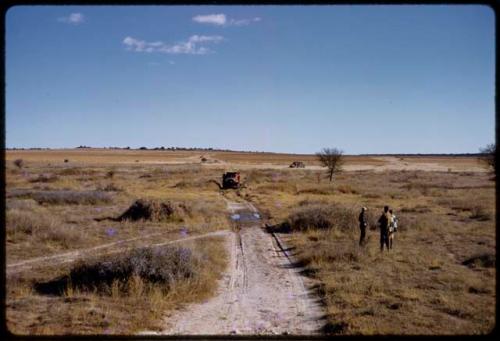 Expedition Dodge truck driving up wet road