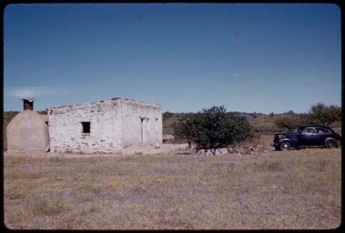 Pump house, car parked to the side