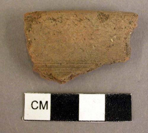 Rim sherd, plain brown ware, wheel made