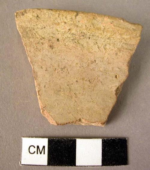 White slipped rim potsherd with dark band around inside of rim