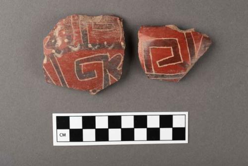 10 potsherds- black on red with incised lines around black- Type IIh