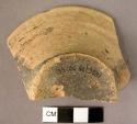 Flat splayed pottery cup fragment