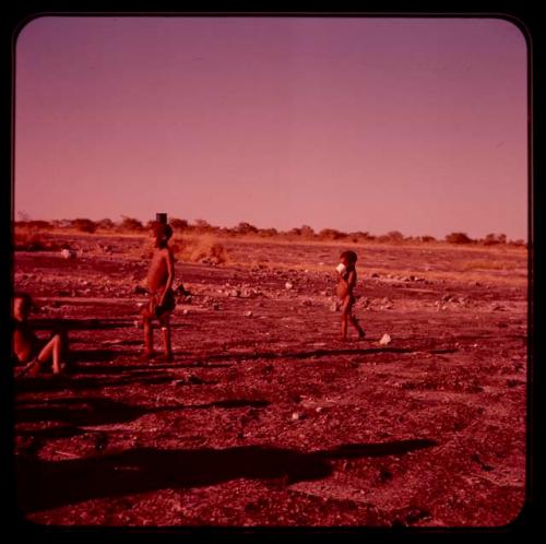 Three boys standing on a shore on "Boer War Memorial Day"