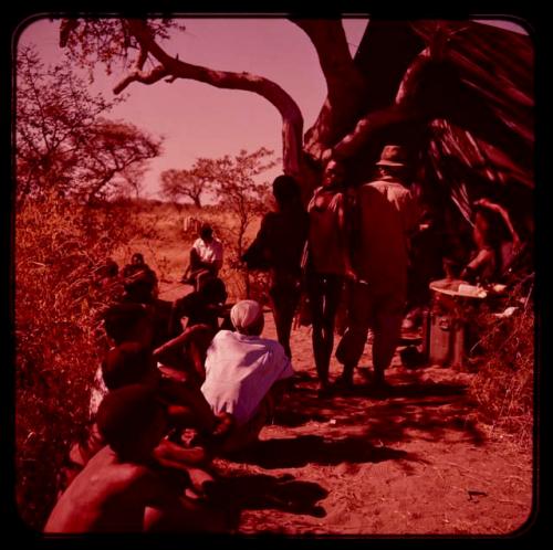 Group of people gathered near a tent