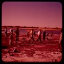 Group of expedition members on pan's shore