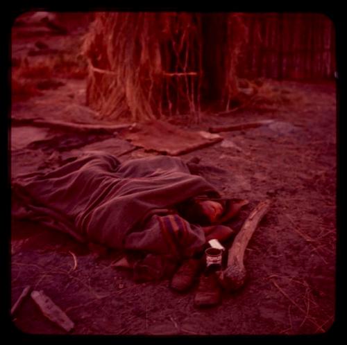 Man sleeping under a blanket