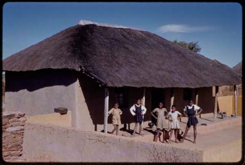 House, children standing in the courtyard