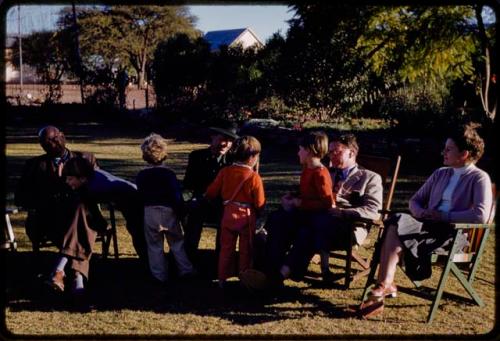 Chief Kgari Sechele, Lorna Marshall, and the Grant family having a tea party