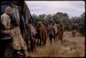 Group of men standing by an expedition truck