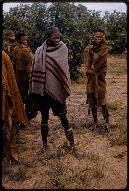 Group of men standing by an expedition truck, close-up