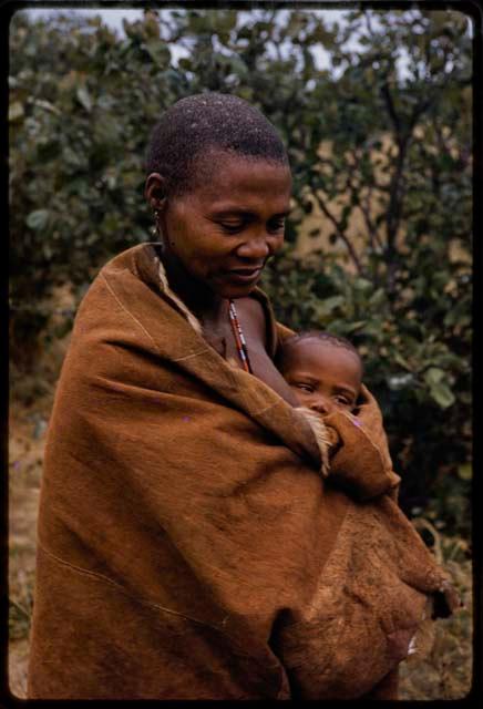 Woman holding a baby, close-up