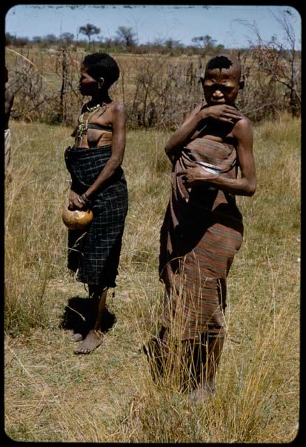 Two women standing, kept hostage by Keremendi in the Oshimporo omuramba