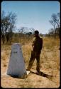 Heinrich Neumann standing next to a beacon on the border between Angola and South West Africa