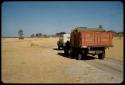 Expedition trucks driving through the flats below Rundu