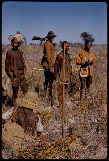 Group of men in a grassy field