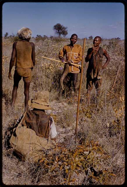 Group of men in a grassy field