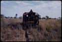 Expedition truck driving in a field of grass