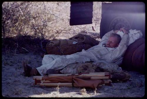 Theunis Berger sleeping by an expedition truck