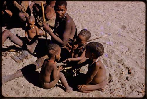 Children sitting beside Mogatsiposi