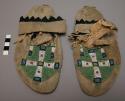 Pair of Plains moccasins, possibly Sioux. Hard soles w/ leather uppers