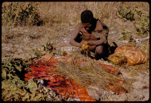 Oukwane squeezing innards in his hands