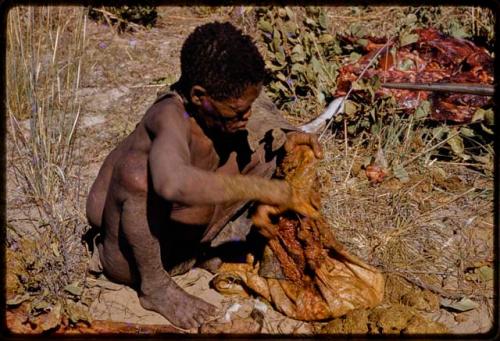 Oukwane holding a gemsbok stomach