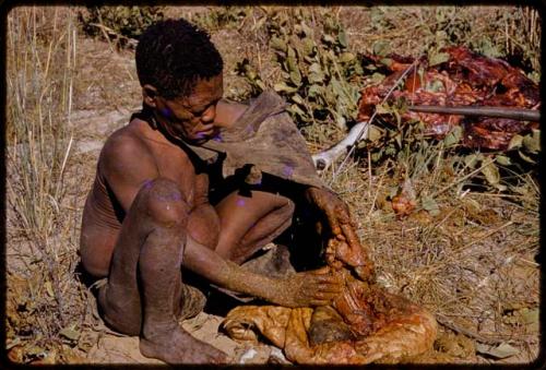 Oukwane holding a gemsbok stomach