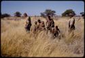 Gai, Tsekue, /Twikwe and children gathering tsama melons, John Marshall and Wilhelm Camm standing nearby