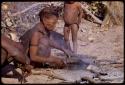 Tsekue cooking at a fire