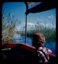 Elizabeth Marshall Thomas riding in a barge on the Okavango River