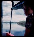 Elizabeth Marshall Thomas riding in a barge on the Okavango River